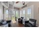 Bright living room features spiral staircase, hardwood floors, modern furniture and lots of natural light at 241 Sapphire Lake Dr # 201, Bradenton, FL 34209