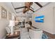 Open floor plan with modern interior design, kitchen access, and ceiling fans at 241 Sapphire Lake Dr # 201, Bradenton, FL 34209