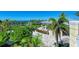 Beautiful outdoor patio area with tables, chairs, and a covered pavilion surrounded by lush greenery at 241 Sapphire Lake Dr # 201, Bradenton, FL 34209