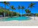 Enjoy a quiet dip in the neighborhood pool, surrounded by lush tropical plants at 241 Sapphire Lake Dr # 201, Bradenton, FL 34209