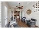 Comfortable sitting area with view of open floorplan, spiral staircase, and shiplap walls at 241 Sapphire Lake Dr # 201, Bradenton, FL 34209