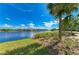 Scenic water view showcasing the beautiful lake, lush greenery, and neighborhood at 241 Sapphire Lake Dr # 201, Bradenton, FL 34209