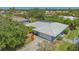 Aerial view of the property with its screen enclosed patio at 301 Angelico Dr, Nokomis, FL 34275