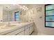 Bright bathroom with a double vanity and ample lighting at 301 Angelico Dr, Nokomis, FL 34275
