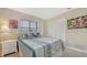 Inviting bedroom featuring a comfortable bed, ample natural light, and closet space for a relaxing atmosphere at 301 Angelico Dr, Nokomis, FL 34275