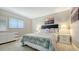 Cozy bedroom with a comfortable queen-size bed, soft lighting, and window, creating a relaxing retreat at 301 Angelico Dr, Nokomis, FL 34275