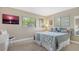 Charming bedroom with coastal-themed decor, bright windows, and comfortable furnishings, creating a relaxing retreat at 301 Angelico Dr, Nokomis, FL 34275