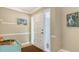 Inviting front entrance features bright decor, and textured glass windows at 301 Angelico Dr, Nokomis, FL 34275