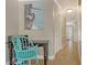 Hallway with a desk, stylish chair, and a picture of a blue heron on the wall at 301 Angelico Dr, Nokomis, FL 34275