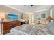 Comfortable main bedroom with a view of the pool and access to the main bathroom at 301 Angelico Dr, Nokomis, FL 34275
