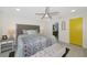 Inviting bedroom featuring a luxurious bed, ambient lighting, and access to a bathroom at 3090 6Th St, Sarasota, FL 34237