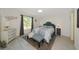 Serene bedroom boasts a window with a view and complementary colored furniture at 3090 6Th St, Sarasota, FL 34237