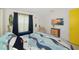 Beautiful bedroom with nautical decor, light walls, and a TV adds a touch of modern comfort at 3090 6Th St, Sarasota, FL 34237