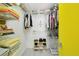 Organized closet with shelving, hanging space, and ample storage for clothes and accessories at 3090 6Th St, Sarasota, FL 34237