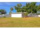 Exterior of home featuring white fence and large yard at 3090 6Th St, Sarasota, FL 34237