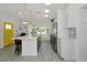 Bright, modern kitchen with an island, stainless appliances, and stylish countertops at 3090 6Th St, Sarasota, FL 34237