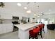 Open kitchen features a large island, stainless steel appliances, modern cabinetry, and a spacious layout for entertaining at 3090 6Th St, Sarasota, FL 34237