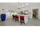 Sleek kitchen features modern countertops, stainless steel appliances, island seating, and lots of natural light at 3090 6Th St, Sarasota, FL 34237