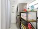 Laundry room with shelving and stacked washer and dryer at 3090 6Th St, Sarasota, FL 34237