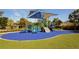 Colorful community playground with slides, climbing structures, and a shaded canopy creating a fun and safe play area at 3090 6Th St, Sarasota, FL 34237