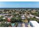 Expansive aerial view of the community showcasing lush landscaping and nearby city at 3336 Pembrook Dr, Sarasota, FL 34239