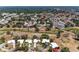 Aerial view showcasing the property amidst a community near a lush golf course and beautiful homes at 3336 Pembrook Dr, Sarasota, FL 34239