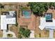 Overhead view of a home with a screened pool, complemented by lush, mature trees at 3336 Pembrook Dr, Sarasota, FL 34239
