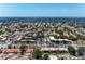 Wide aerial view of residential streets, lush landscaping, with the ocean in the distance at 3336 Pembrook Dr, Sarasota, FL 34239