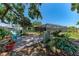 Backyard with covered patio and lush landscaping at 3336 Pembrook Dr, Sarasota, FL 34239