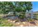 Charming backyard patio with pergola and lush garden, perfect for relaxing at 3336 Pembrook Dr, Sarasota, FL 34239