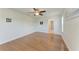 Spacious bedroom with hardwood floors, natural light, and a bathroom, great for relaxation at 3336 Pembrook Dr, Sarasota, FL 34239