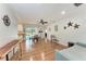 Bright dining area with wood floors and access to the pool, perfect for Gathering meals and entertaining at 3336 Pembrook Dr, Sarasota, FL 34239
