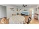 Cozy dining room with wood floors, a patterned tablecloth, and nautical decorations creating a charming atmosphere at 3336 Pembrook Dr, Sarasota, FL 34239
