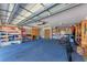Spacious garage with shelving and ample storage space for tools and equipment at 3336 Pembrook Dr, Sarasota, FL 34239