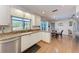 Bright kitchen with white cabinets, granite countertops, and stainless-steel appliances at 3336 Pembrook Dr, Sarasota, FL 34239