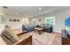 Cozy living room with hardwood floors, stylish furniture, and ample natural light creating an inviting atmosphere at 3336 Pembrook Dr, Sarasota, FL 34239