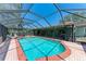 Screened-in pool with ample patio space for entertaining at 3336 Pembrook Dr, Sarasota, FL 34239