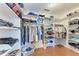 Walk-in closet with custom shelving and hanging racks for optimal storage at 3336 Pembrook Dr, Sarasota, FL 34239