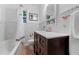 Traditional bathroom with a single vanity, tub with shower, and neutral finishes and fixtures at 344 N Lantana N Ave, Sarasota, FL 34243