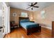 Serene bedroom with hardwood floors, a ceiling fan, and natural light at 344 N Lantana N Ave, Sarasota, FL 34243
