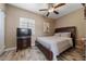 Bedroom featuring a comfy bed, wood floors, a large window, and neutral wall colors at 344 N Lantana N Ave, Sarasota, FL 34243