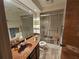 Bathroom featuring a toilet, shower with sliding glass door, and vanity with an integrated sink at 3805 E Bay Dr # 302, Holmes Beach, FL 34217