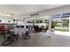 Enjoy the outdoor space with tile flooring under the covered patio and view of lush landscaping and a spa at 3889 Canopy Way, Sarasota, FL 34235