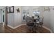 Cozy dining area with natural light, wood floors, and charming decor at 3889 Canopy Way, Sarasota, FL 34235