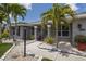 Close-up of the inviting front entrance with decorative wreath and landscaping at 3889 Canopy Way, Sarasota, FL 34235
