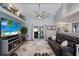 Well-lit living area features access to the patio and beach decor accents at 3889 Canopy Way, Sarasota, FL 34235