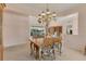 Traditional dining room featuring a chandelier and a view to the outside patio at 4356 Highland Oaks Cir # 3, Sarasota, FL 34235