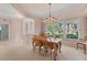 Dining room with large windows and chandelier at 4356 Highland Oaks Cir # 3, Sarasota, FL 34235