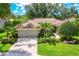 Charming single-story home with lush landscaping, brick driveway, and neutral paint at 4356 Highland Oaks Cir # 3, Sarasota, FL 34235