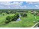 Expansive golf course landscape with a winding waterway and manicured green, offering serene views at 4356 Highland Oaks Cir # 3, Sarasota, FL 34235